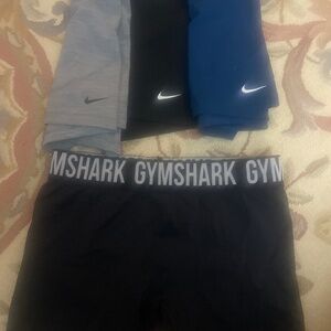 Blue, black and gray Nike Pro shorts and GymShark size M